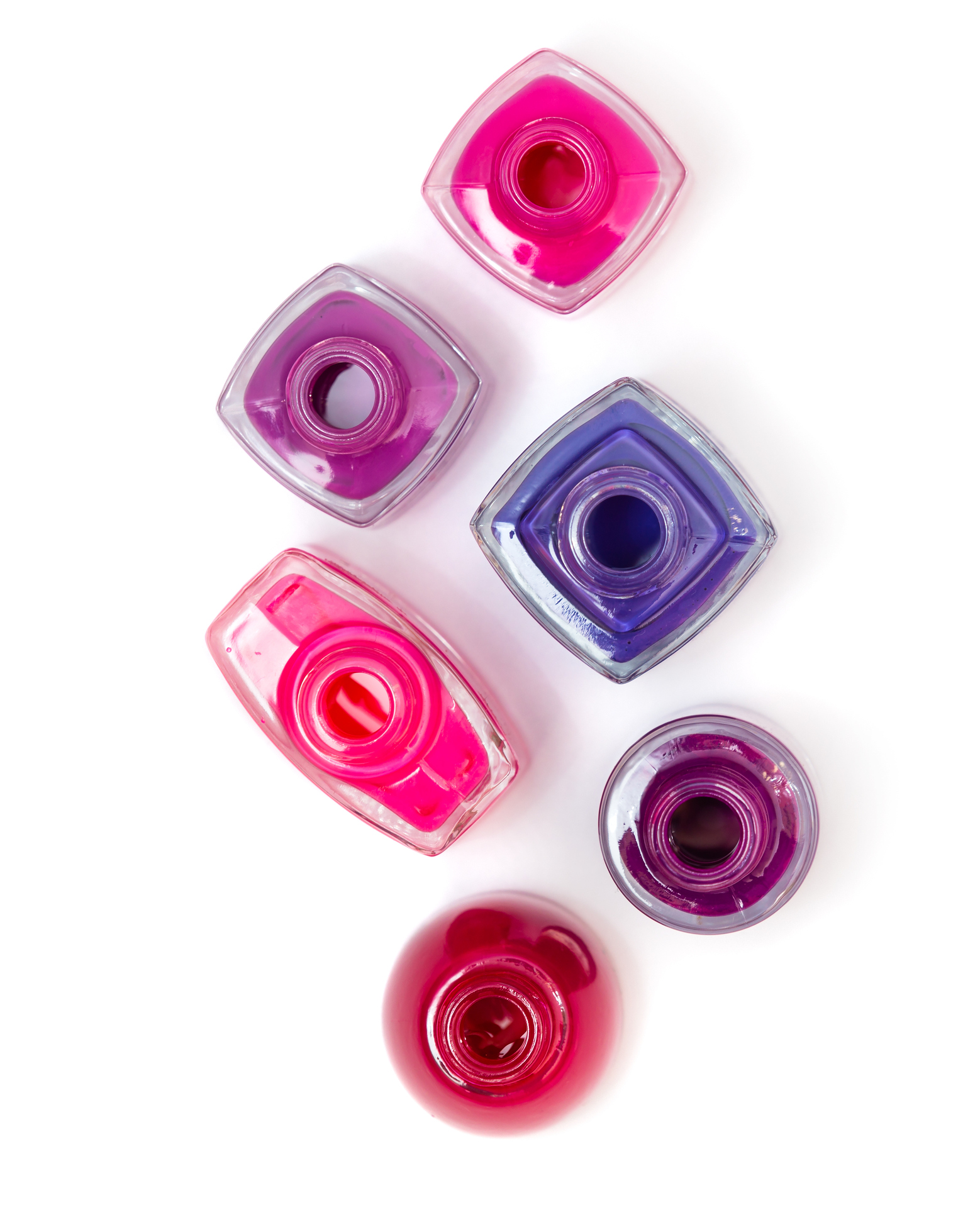 open bottles with bright nail polish isolated