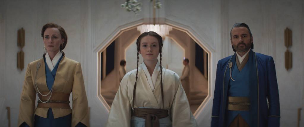 ANDOR (LR): Mon Mothma (Genevieve O'Reilly), Leida Mothma (Bronte Carmichael) and Perrin Fertha (Alastair Mackenzie) in Lucasfilm's ANDOR, exclusively on Disney+. ©2022 Lucasfilm Ltd. & TM. All Rights Reserved.
