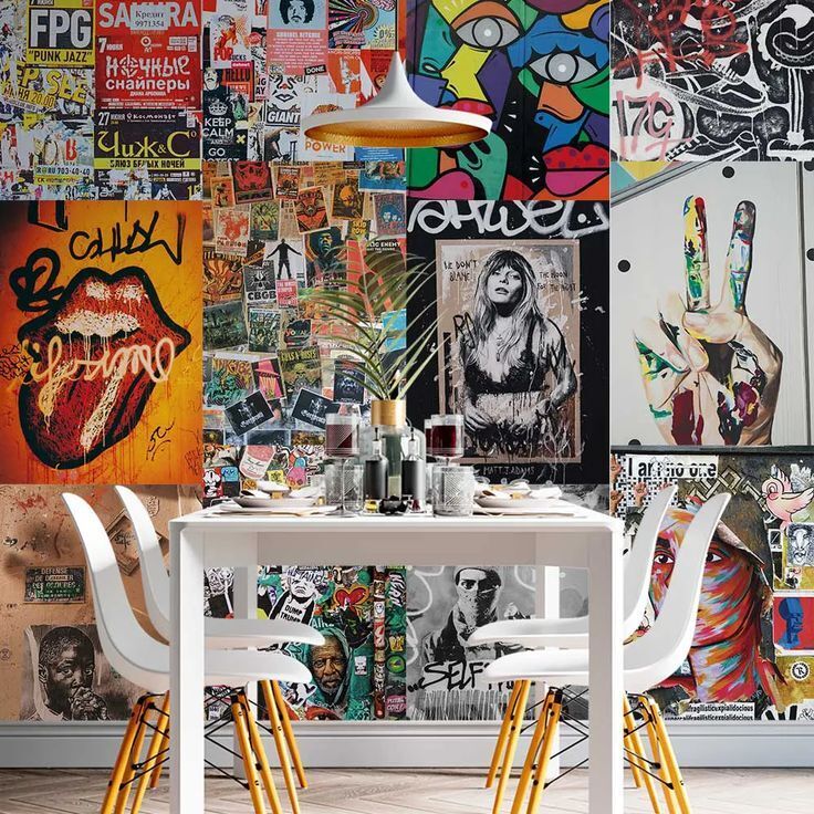 Sala de jantar com parede de lambe-lambes em estilo pop art e grafite, com ilustra&ccedil;&otilde;es vibrantes e refer&ecirc;ncias urbanas que criam uma decora&ccedil;&atilde;o moderna e ousada