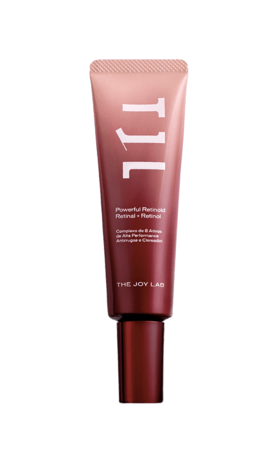 Tubo de creme facial The Joy Lab Powerful Retinoid, em tons de rosa claro na parte superior e vinho na inferior, com tampa vinho. O texto branco na embalagem descreve Retinal + Retinol, Complexo de 8 Ativos de Alta Performance Antirrugas e Clareador